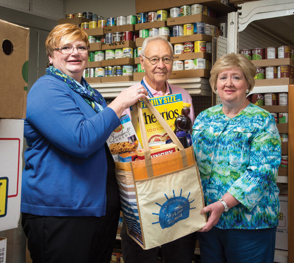SkyLine's Karin Nichols with Solid Rock's David Carpenter and Teresa March